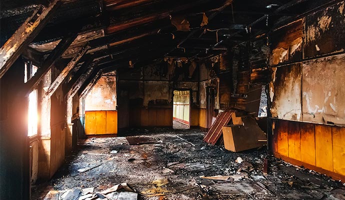 burned interiors after fire in industrial or office building fire damage restoration